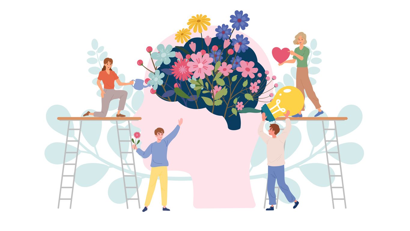 Teamwork of people recovery a brain with beautiful flowers and good heart and positive thinking. Concept for wellness of mental health and mindfulness in depression and mental illness.